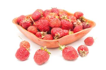 Ripe strawberries in wooden tray isolated on white background