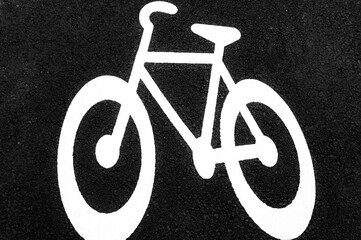 biking sign on asphalt