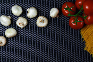 tomato mushrooms pasta on a dark background, place for insertion, background