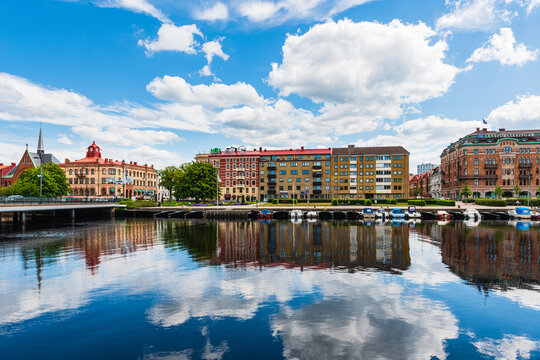 Buildings at Halmstad city in front of still river, Sweden
