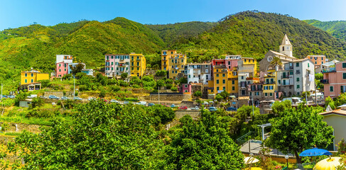 Obraz premium A panorama view across the Cinque Terre village of Corniglia, Italy in the summertime