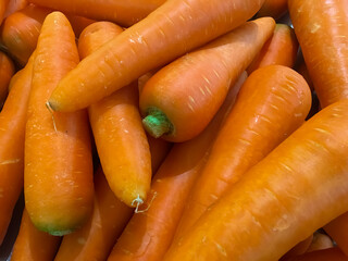 Many orange carrots, placed as a background image