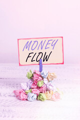 Writing note showing Money Flow. Business concept for it is an indicator of positive or negative in...