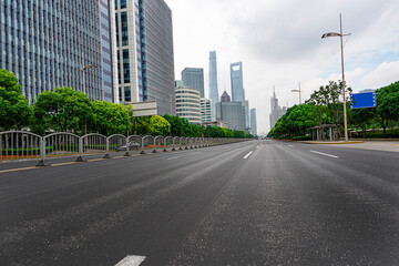 Fototapeta premium highway transportation and the high-rise building unde in the blue sky.