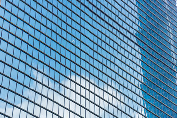 Fototapeta na wymiar Window glass, Modern architecture in the blue sky white cloud city