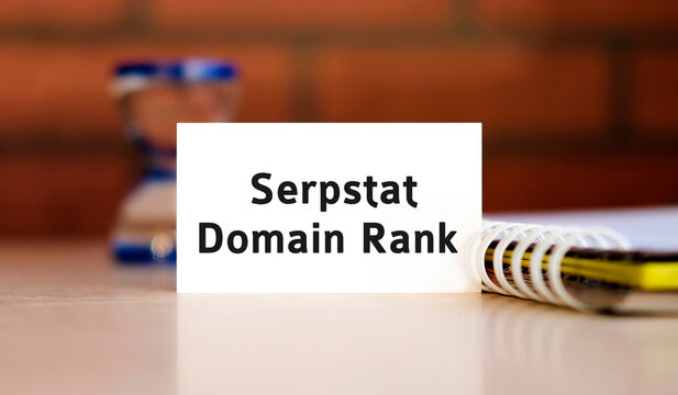 Domain rank text n white sheet with notepad and hourglass