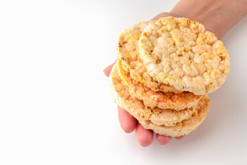 cornbread in hand on a white background. healthy food. macro. isolate
