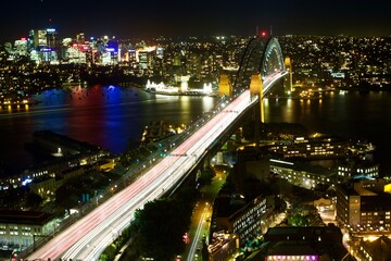 Fototapeta na wymiar night view of the city of Sydney with the harbour bridge crossing the bay