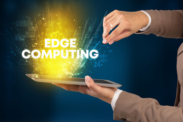 Obraz premium Close-up of a touchscreen with EDGE COMPUTING inscription, innovative technology concept