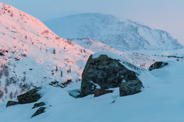 Stones in front of winter mountain