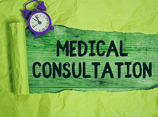 Word writing text Medical Consultation. Business photo showcasing act of seeking assistance from another physician Rolled ripped torn cardboard placed above a wooden classic table backdrop