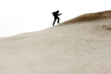 Tourist running up on hill