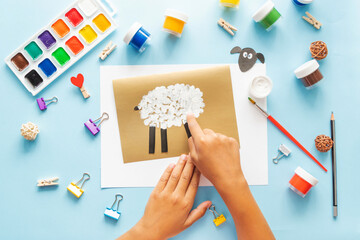 4 Diy Eid al adha lamb sheep baby craft on blue background. Gift idea, decor Eid al adha. Step by step. Top view. Process kid children craft.