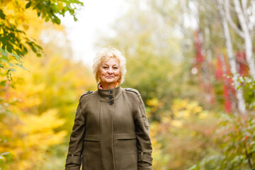 Senior citizen stroll in a park in autumn