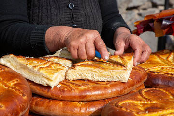 Cutting Armenian bread known as Gata Bread, Armenia