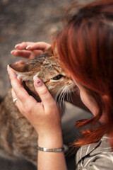 young woman holding a cat
