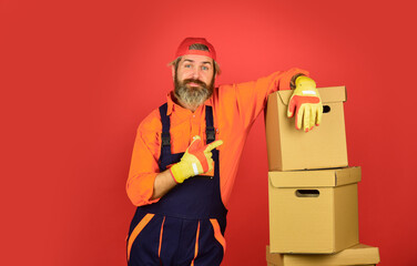 Moving concept. Moving house day. think outside the box. express delivery concept. Man worker in...
