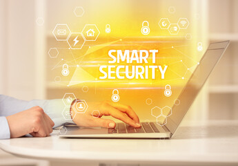 SMART SECURITY inscription on laptop, internet security and data protection concept, blockchain and...