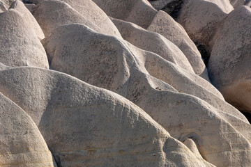 Love valley in Cappadocia closeup of rock formations background