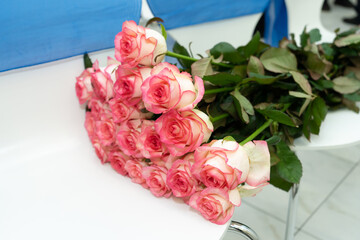 Bouquet of fresh flowers from pink-white roses