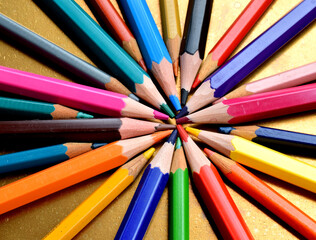 Fototapeta premium colored pencils isolated on golden background