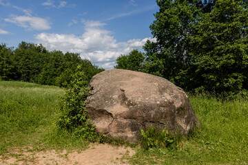 Landscape with a large stone in summer