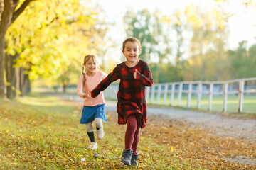 Fototapeta premium two little girls in autumn park