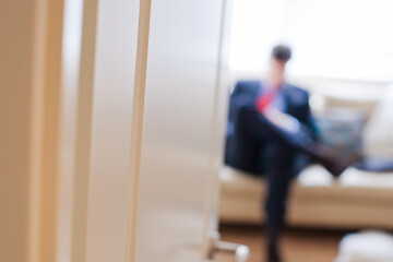 businessmen sitting in a room and waiting