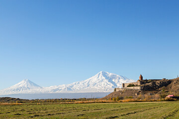 Fototapeta premium Khor Virap Monastery with the two peaks of the Mount Ararat in the background in Armenia