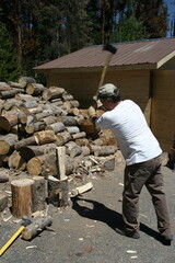 man splitting firewood