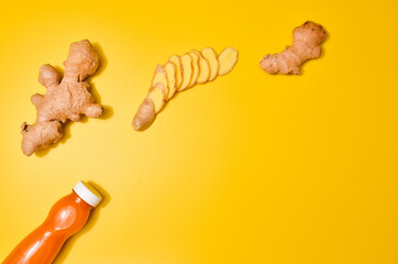 Ginger in different conditions: fresh, dry root, pills and cut plant on pastel yellow orange background.