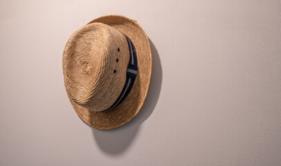 Beach hat decoration on white wall in livingroom interior