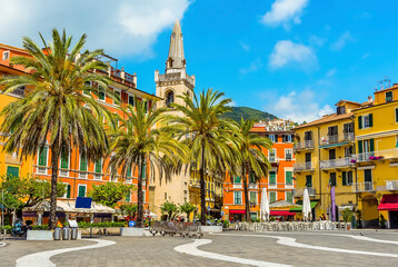 The church and colourful buildings stand proud in the central square in Lerici, Italy in the...