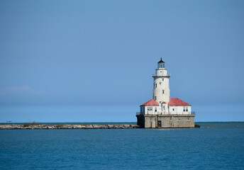 The Chicago Harbor Lighthouse stands at the south end of the northern breakwater protecting the Chicago Harbor, to the east of Navy Pier and the mouth of the Chicago River.