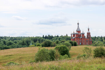 Beautiful Transfiguration Church made from red brick near the Volga source. Russia