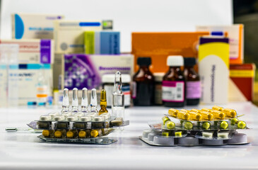 The recipe for treatment. Pharmaceuticals, medicine in a container for health. Pharmacy theme, pills in capsules.