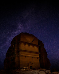 Mada'in Saleh archaeological site with starry night sky, near Al Ula, Saudi Arabia