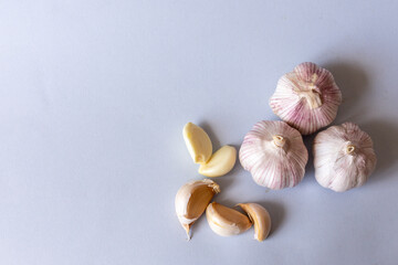 garlic lies on a gray background. Photographed at close range. . High quality photo