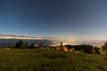 Fototapeta premium Comet NEOWISE from Dobratsch with View To Villach Carinthia Austria By Night