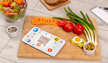 Healthy Tablet Pc compostion with CHANGE HABITS inscription, weight loss concept