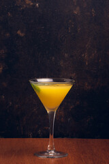 Fruit Martini on rustic background with space for text. Vertical shot.