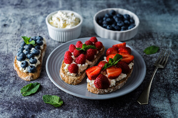Fresh breakfast with Blueberry, Strawberry and raspberry ricotta rye sandwiches