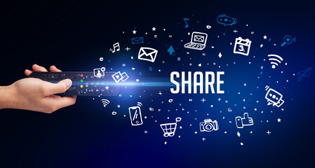 hand holding wireless peripheral with SHARE inscription, social media concept