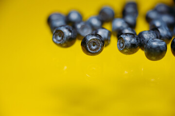 Blueberries close-up on a yellow background. Super Foods, Vegetarian. Copy Space
