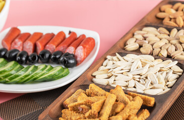 Cucumber sausage salad with crackers and dry fruits