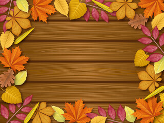 autumn leaves frame on wooden background