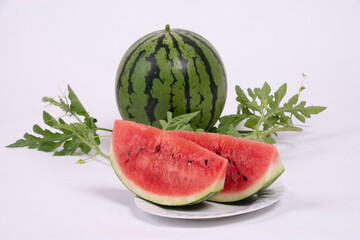 夏の代表的な食材のスイカを花からつぼみやカットした写真を撮影、素材背景にどうぞ
