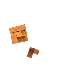Wooden puzzle cube 7. Wooden puzzle consisting of 7 parts isolated on a white background.