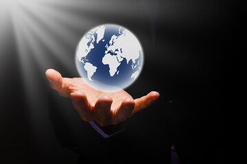 holding a glowing earth globe in his hands