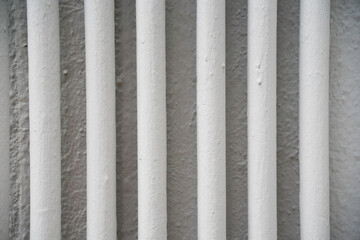 Several pipes on the white wall